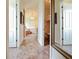 Bathroom hallway with tile floors and access to the Primary bathroom and closet at 1217 Radiant St, Reunion, FL 34747