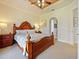 Bright Primary bedroom featuring a king-size bed and ample natural light at 1217 Radiant St, Reunion, FL 34747