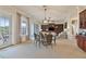 Spacious dining area with glass top table and access to a patio at 1217 Radiant St, Reunion, FL 34747
