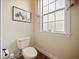 Small half bathroom with toilet and pedestal sink at 1217 Radiant St, Reunion, FL 34747