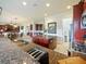 Open kitchen features granite countertops, breakfast bar, and stainless steel appliances at 1217 Radiant St, Reunion, FL 34747