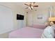 Guest bedroom with two twin beds and ceiling fan at 1217 Radiant St, Reunion, FL 34747