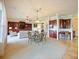 Open dining area with a view to living room and kitchen at 1217 Radiant St, Reunion, FL 34747