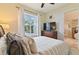 Bedroom with wood furniture and access to the hallway at 1217 Radiant St, Reunion, FL 34747