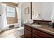 Clean bathroom with granite vanity and tub shower combo at 1217 Radiant St, Reunion, FL 34747