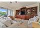 Living room with built-in shelving and patio access at 1217 Radiant St, Reunion, FL 34747