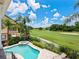 Inviting pool and spa with a stunning golf course view at 1217 Radiant St, Reunion, FL 34747