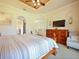 Primary bedroom with a king-size bed, TV, and plenty of closet space at 1217 Radiant St, Reunion, FL 34747