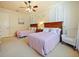 Guest bedroom with two twin beds and ceiling fan at 1217 Radiant St, Reunion, FL 34747