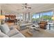 Open living room with access to the patio and kitchen at 1217 Radiant St, Reunion, FL 34747