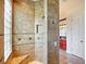 Walk-in shower with glass block window and built-in seat at 1217 Radiant St, Reunion, FL 34747