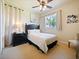 Cozy bedroom with a queen-size bed and ceiling fan at 1217 Radiant St, Reunion, FL 34747