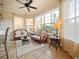 Bright breakfast nook with wicker furniture and view of backyard at 1217 Radiant St, Reunion, FL 34747