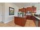 Gourmet kitchen with island, stainless steel appliances, and granite countertops at 1217 Radiant St, Reunion, FL 34747
