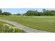 Landscaped golf course with walking path at 1217 Radiant St, Reunion, FL 34747