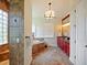 Primary bathroom with soaking tub, walk-in shower, and double vanity at 1217 Radiant St, Reunion, FL 34747