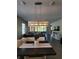 Dining room with a chandelier and view into the living room at 4342 Southern Vista Loop, Saint Cloud, FL 34772