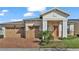 Two-story house with a two-car garage and brick driveway at 2686 Meadowedge Loop, Saint Cloud, FL 34772