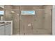 Spacious double shower with glass enclosure and built-in seat at 2686 Meadowedge Loop, Saint Cloud, FL 34772
