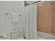 Simple bathroom with shower/tub combo and white curtain at 2686 Meadowedge Loop, Saint Cloud, FL 34772