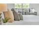 Bright and airy main bedroom with a plush bed and pillows at 2686 Meadowedge Loop, Saint Cloud, FL 34772
