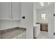 Laundry room with washer, dryer, and extra counter space at 2686 Meadowedge Loop, Saint Cloud, FL 34772