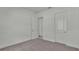Bright bedroom with gray carpet and two doors at 2686 Meadowedge Loop, Saint Cloud, FL 34772