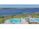 Aerial view of community pool and clubhouse near a lake at 2686 Meadowedge Loop, Saint Cloud, FL 34772