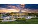 Evening view of community pool and clubhouse at 2686 Meadowedge Loop, Saint Cloud, FL 34772