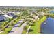 Gated entrance to a beautiful community with palm trees and a lake at 2686 Meadowedge Loop, Saint Cloud, FL 34772
