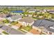 Aerial view of houses and a lake in a community at 2686 Meadowedge Loop, Saint Cloud, FL 34772