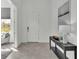 Bright and airy entryway with tile floors and a console table at 2686 Meadowedge Loop, Saint Cloud, FL 34772