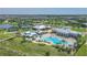 Aerial view of community amenities including pool, clubhouse, and tennis courts at 2686 Meadowedge Loop, Saint Cloud, FL 34772