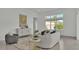 Light-filled living room featuring a comfortable seating area at 2686 Meadowedge Loop, Saint Cloud, FL 34772
