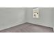 Simple bedroom with gray carpet and window at 2686 Meadowedge Loop, Saint Cloud, FL 34772