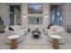 Relaxing lounge area with curved sofas and modern decor at 2686 Meadowedge Loop, Saint Cloud, FL 34772