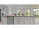 Modern kitchen island with granite countertop and stainless steel appliances at 2686 Meadowedge Loop, Saint Cloud, FL 34772