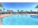 Resort-style pool with multiple cabanas and lounge areas at 2686 Meadowedge Loop, Saint Cloud, FL 34772