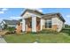 Two-story house with a two-car garage and brick driveway at 2686 Meadowedge Loop, Saint Cloud, FL 34772