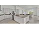 Modern kitchen with granite countertops, stainless steel appliances, and island at 2686 Meadowedge Loop, Saint Cloud, FL 34772