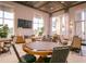 Game room with multiple card tables and comfortable seating at 2686 Meadowedge Loop, Saint Cloud, FL 34772