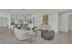 Open concept living room with views into the kitchen area at 2686 Meadowedge Loop, Saint Cloud, FL 34772