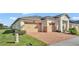 Two-story house with a two-car garage and brick driveway at 2686 Meadowedge Loop, Saint Cloud, FL 34772