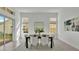 Bright dining area with large windows and wooden table at 2686 Meadowedge Loop, Saint Cloud, FL 34772