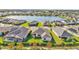 Aerial view of houses surrounding a lake in a community at 2686 Meadowedge Loop, Saint Cloud, FL 34772