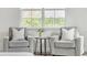 Cozy sitting area with two armchairs and a side table at 2686 Meadowedge Loop, Saint Cloud, FL 34772
