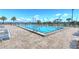 Community lap pool with spacious deck and lounge chairs at 2686 Meadowedge Loop, Saint Cloud, FL 34772