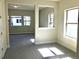 Spacious bonus room with neutral carpeting and multiple windows at 8059 Leaf Grove Cir, Orlando, FL 32836
