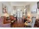 Light-filled living room with comfortable seating and hardwood floors at 100 Moss Ln, Davenport, FL 33837