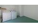 Laundry room with washer, dryer, and extra storage at 824 Park Lake Pl # 824, Maitland, FL 32751